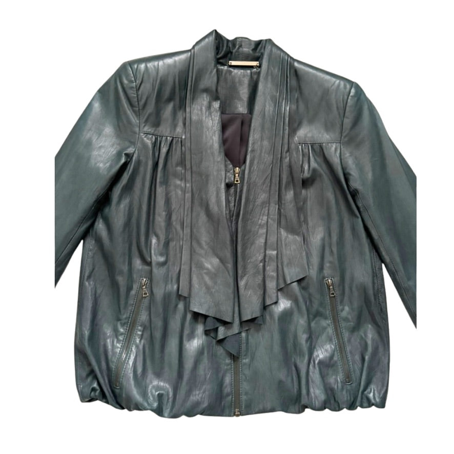 Green leather jacket with layered design on a white background