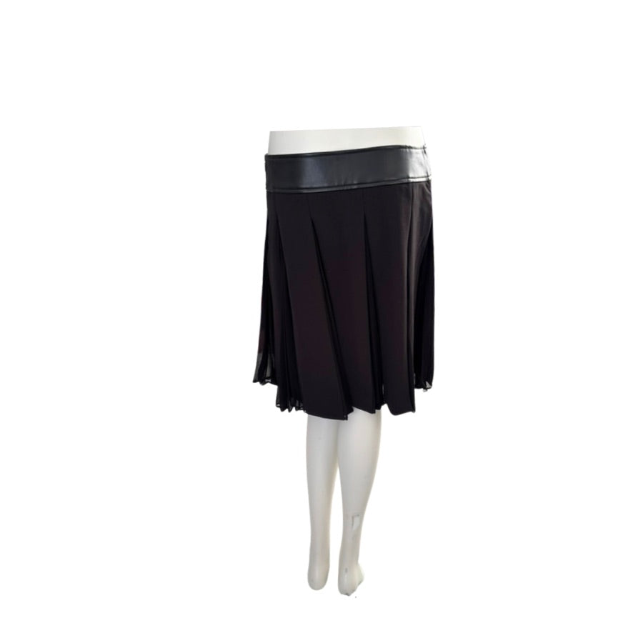 Black skirt with silver waistband on a mannequin against a white background