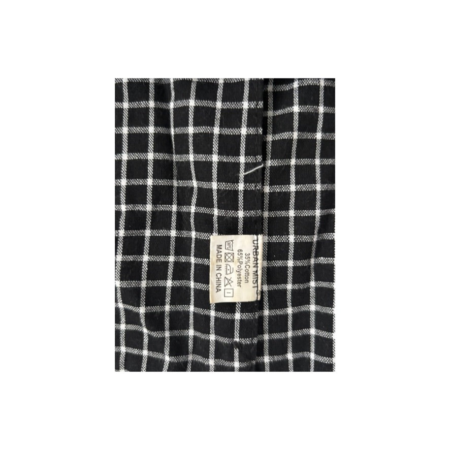 Black and white checkered fabric with a label on a white background