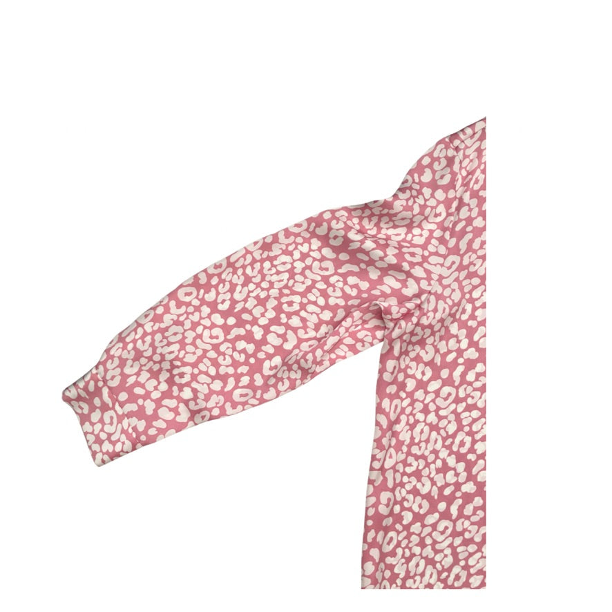 Pink headband with white floral pattern on a white background