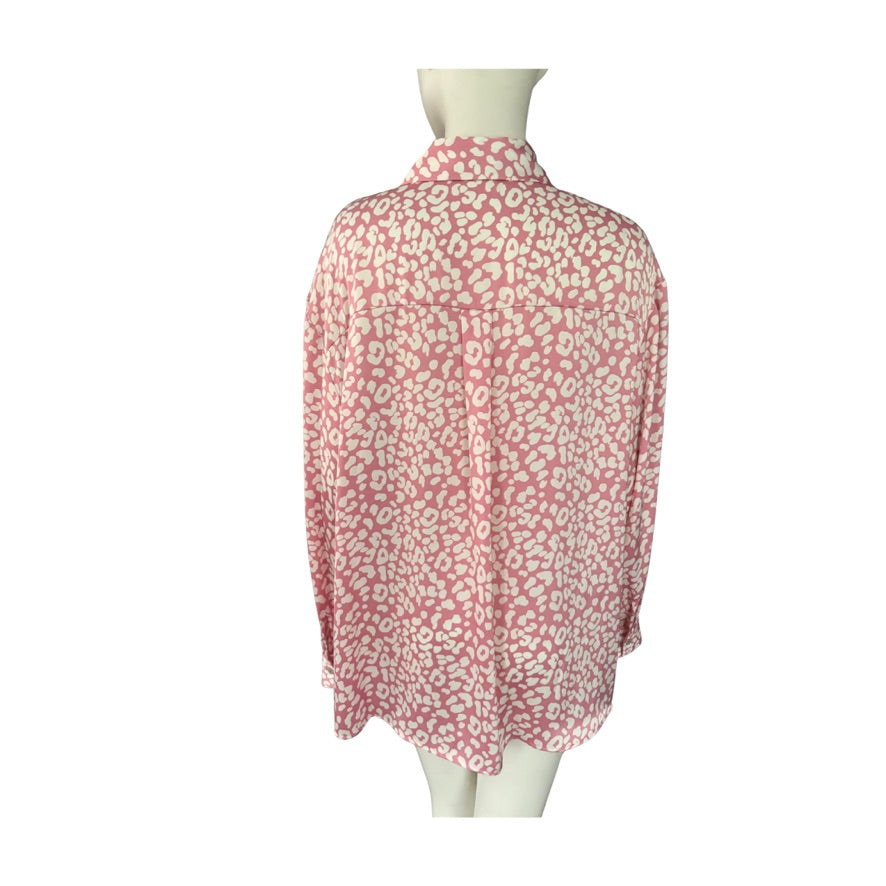 Pink leopard blouse on a mannequin against a white background