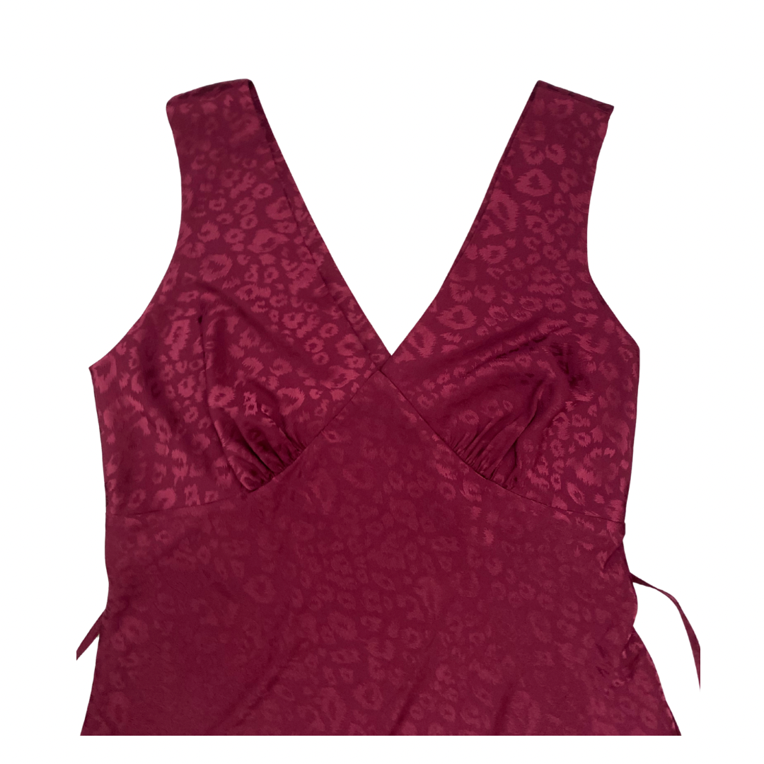 Maroon tank top with a subtle pattern on a white background
