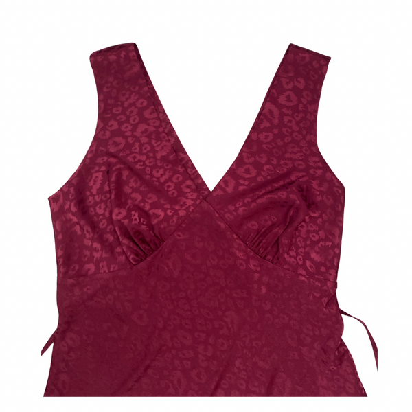 Maroon tank top with a subtle pattern on a white background