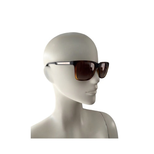 Sunglasses on a mannequin head against a white background