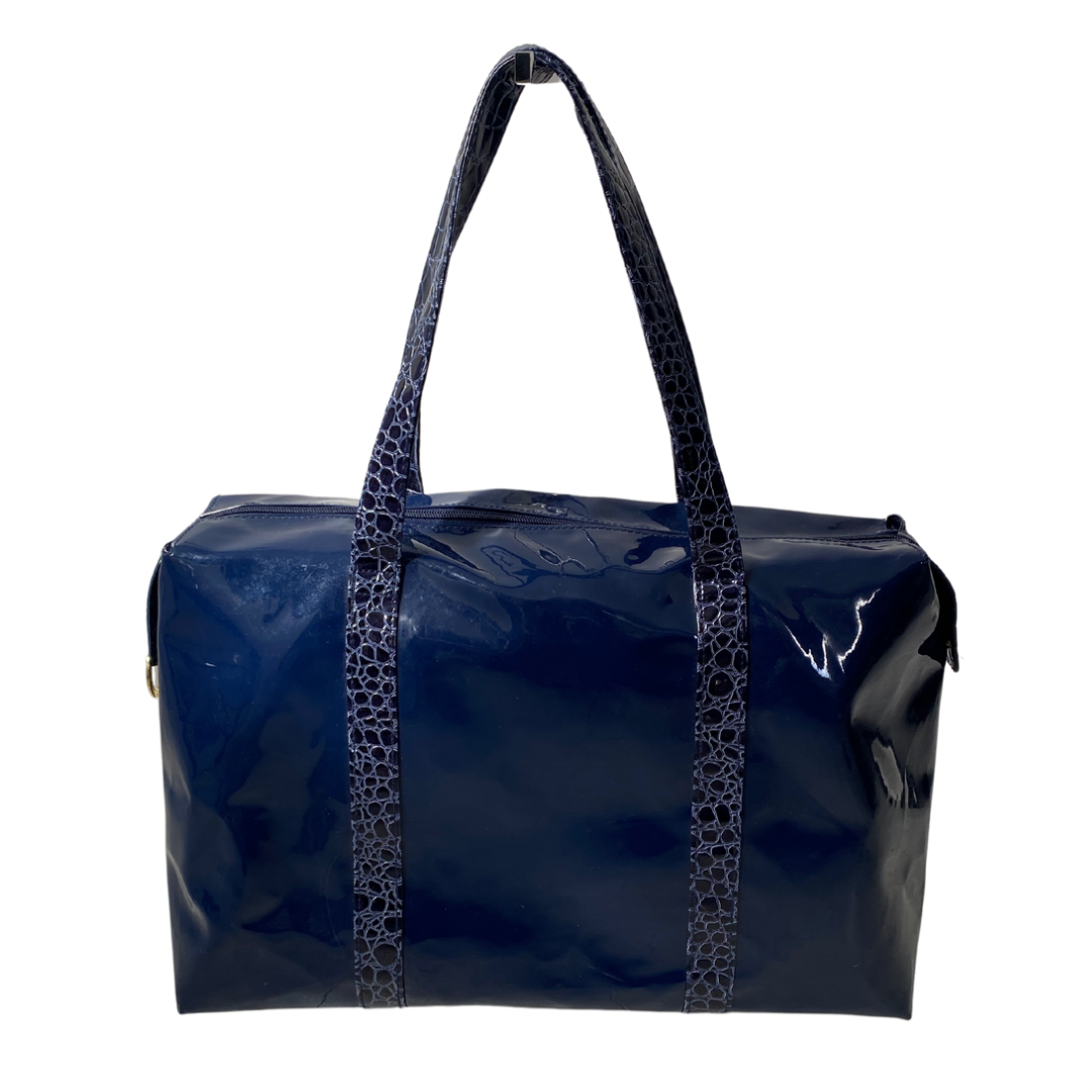 Navy patent tote bag with faux croc straps and gold hardware, displayed against a plain background.