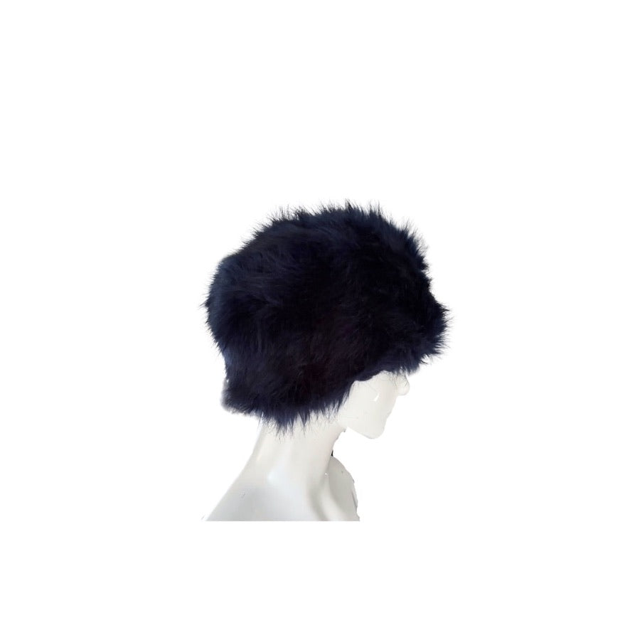 Navy fur hat on a mannequin head against a white background