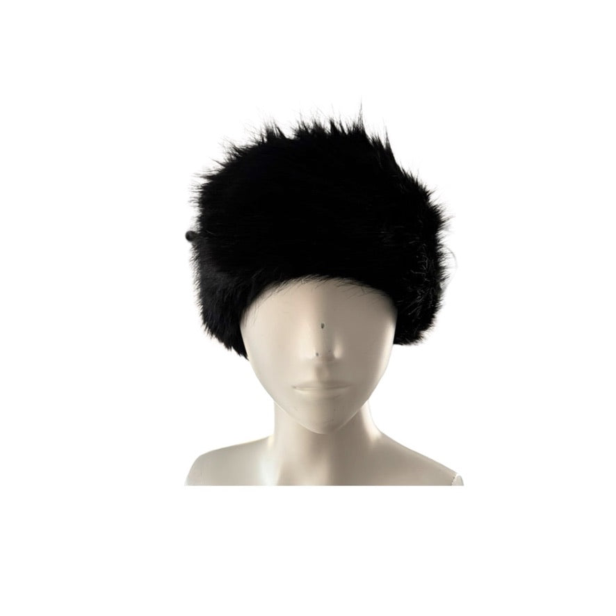 Black fur headband on a mannequin head against a white background