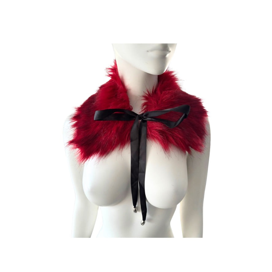 Red fur collar with a black ribbon on a mannequin against a white background