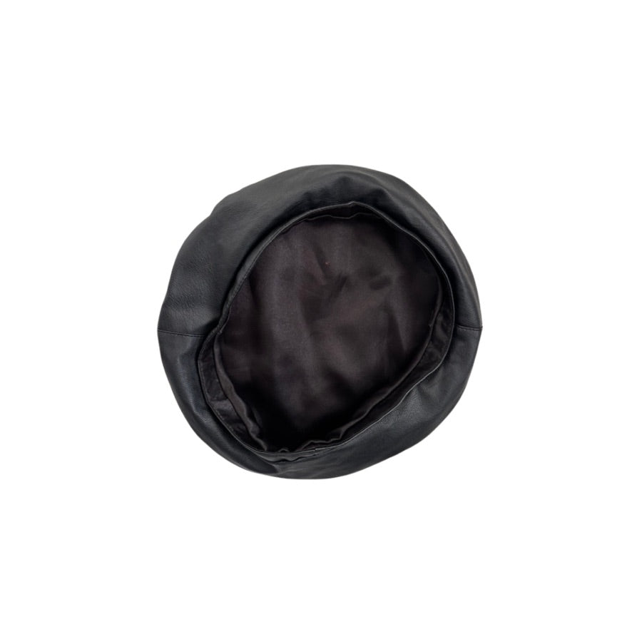 Black leather beret on a white background