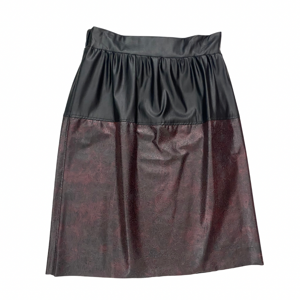 Two-tone black and burgundy embossed leather skirt, size M, preloved, laid flat.