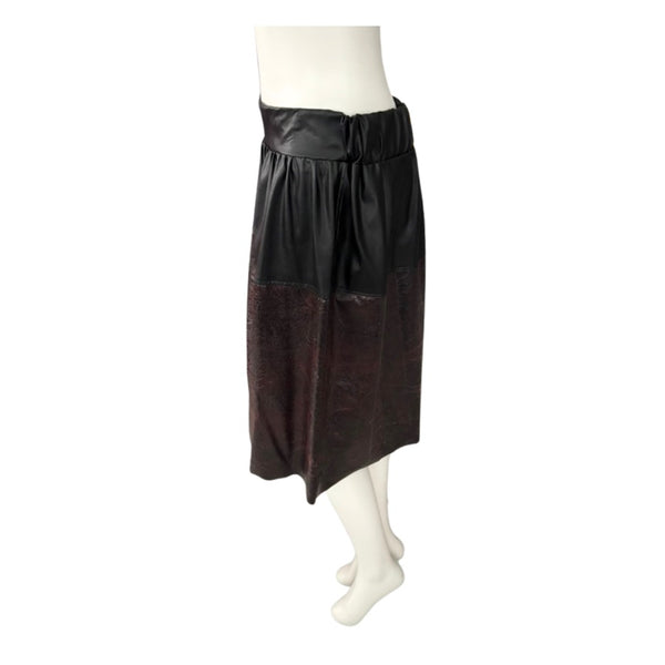 Black and burgundy leather skirt on a mannequin against a white background