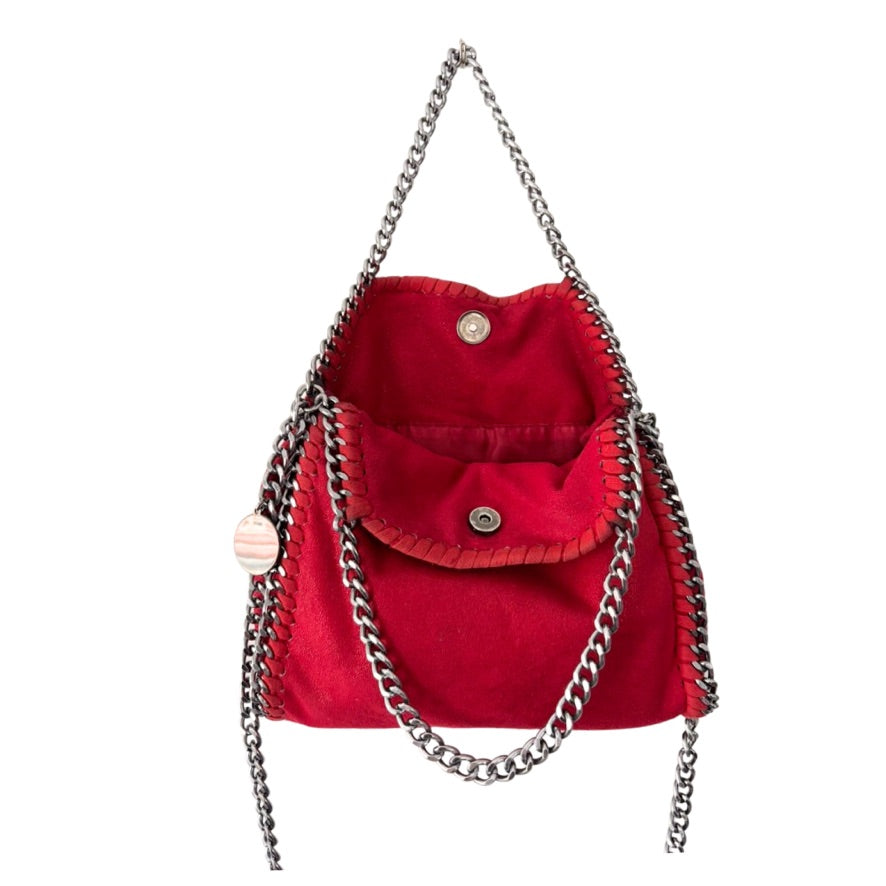 Red handbag with chain detail on a white background