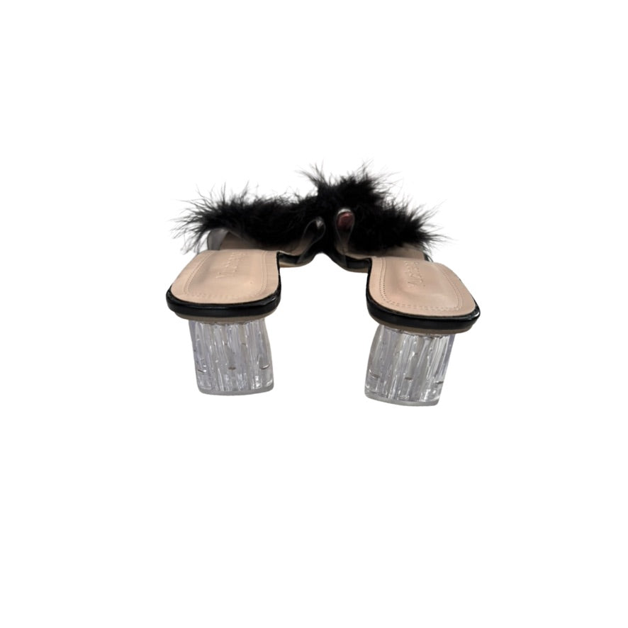 Mule shoes with fur and glittery sole on a white background