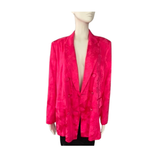 Mannequin wearing a bright pink blazer on a white background