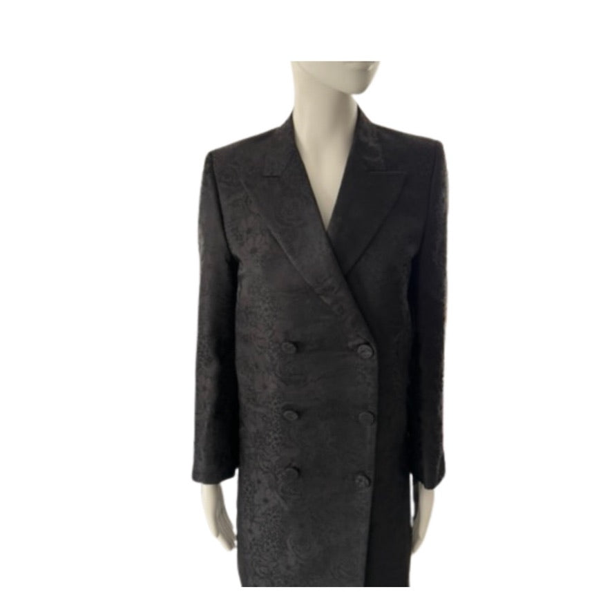 Black coat on a mannequin against a white background