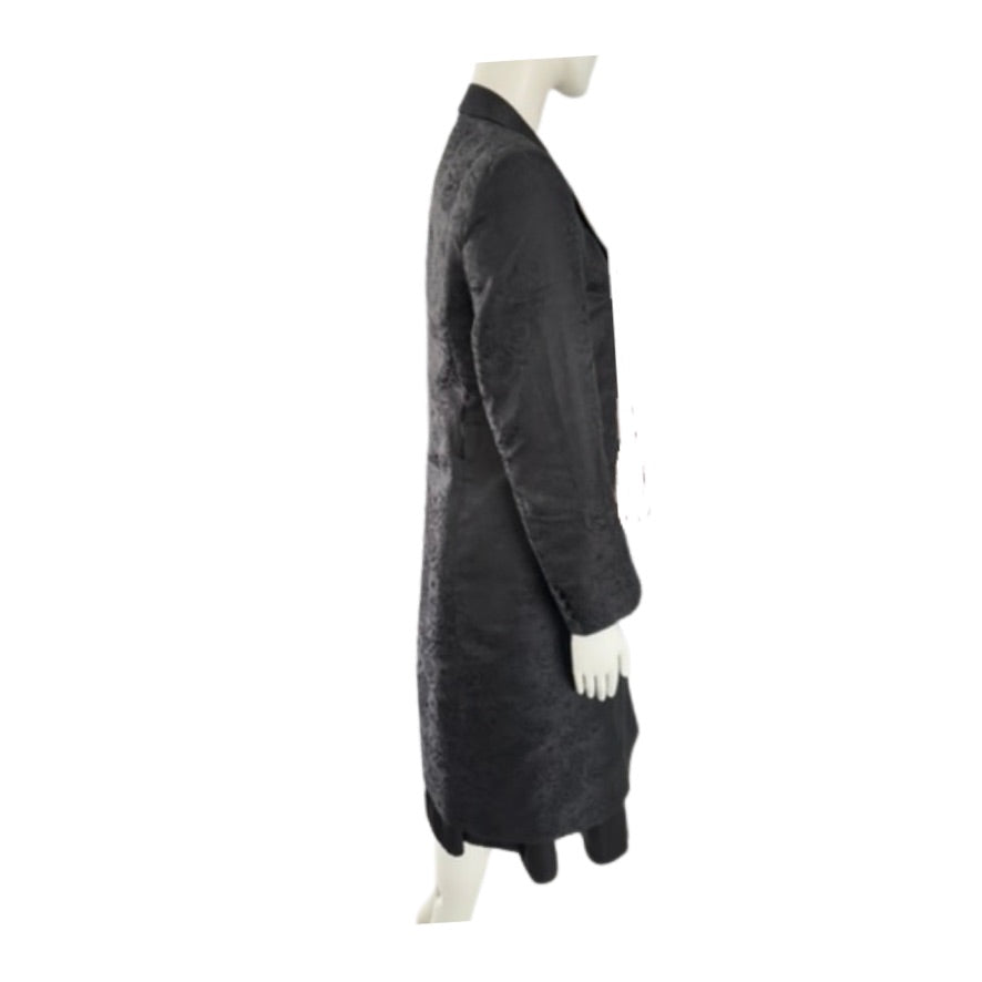 Mannequin wearing a long dark coat on a white background