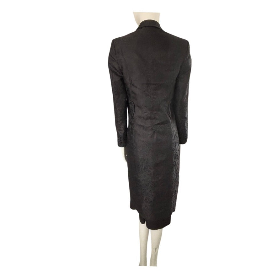 Black coat on a mannequin against a white background