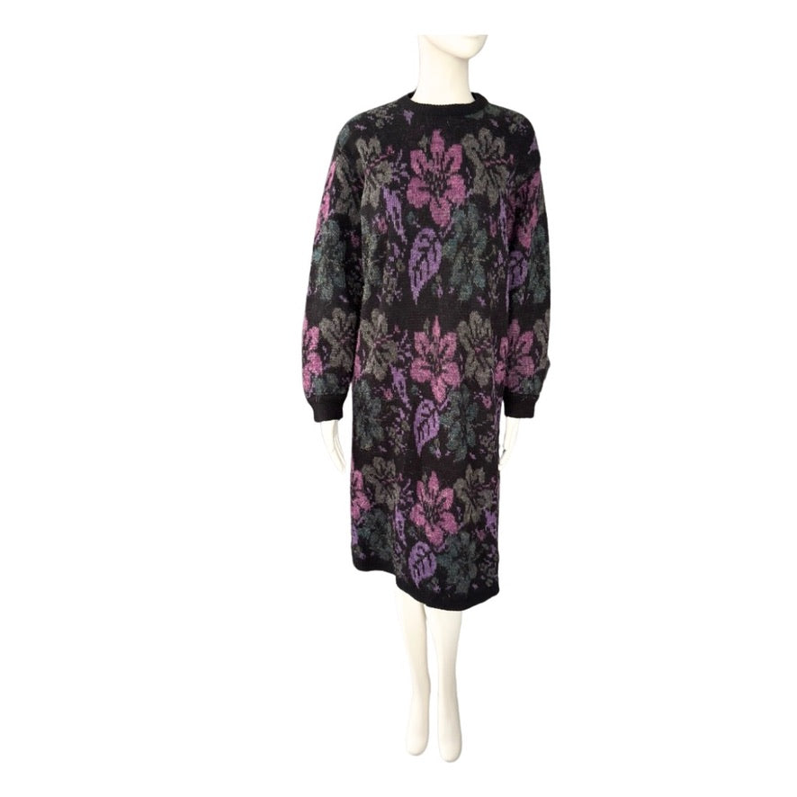 Black dress with floral pattern on a mannequin against a white background