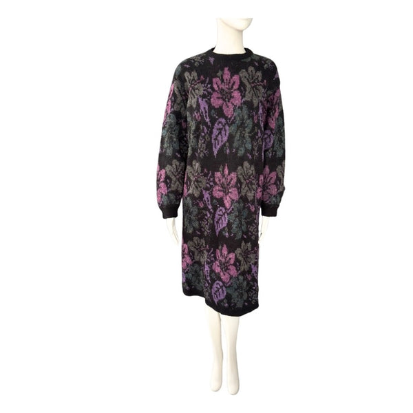 Black dress with floral pattern on a mannequin against a white background