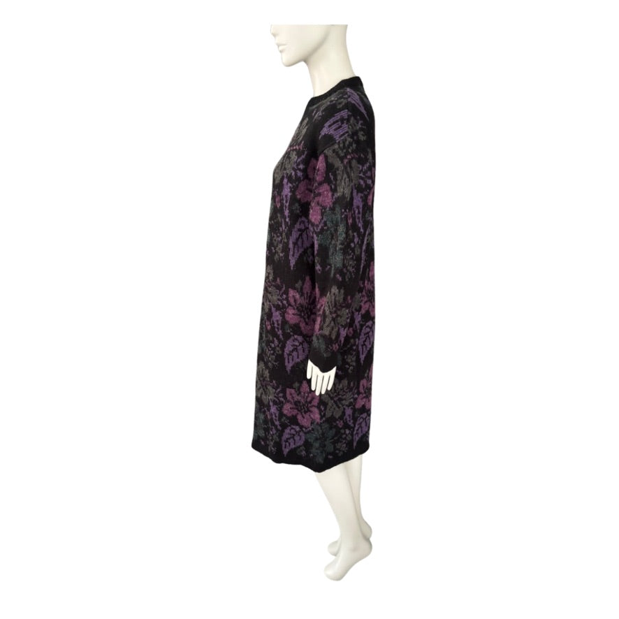 Mannequin wearing a black dress with purple floral patterns on a white background