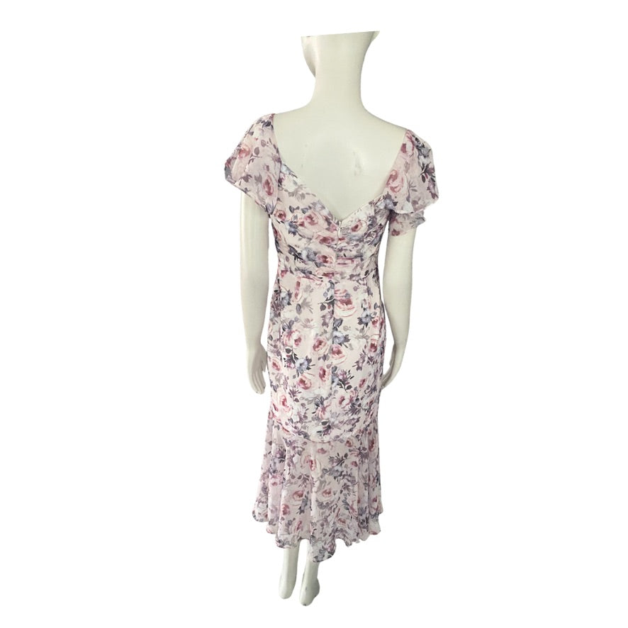 Floral dress on a mannequin against a white background