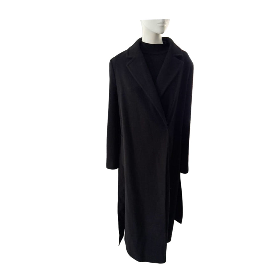 Black coat on a mannequin against a white background