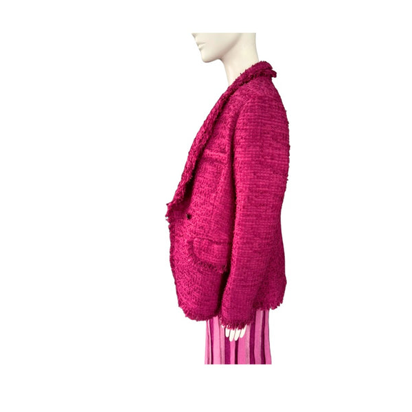 Mannequin wearing a bright pink textured cardigan on a white background