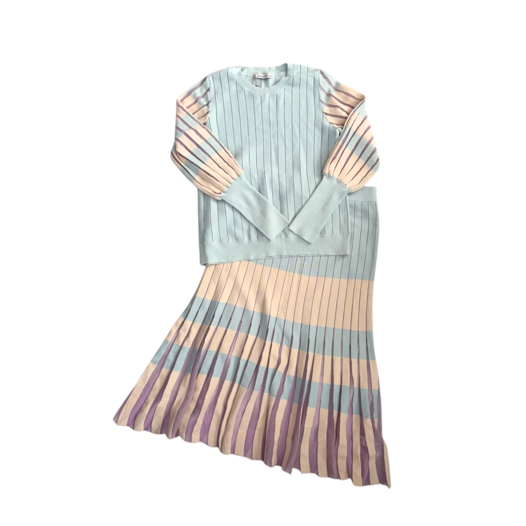 Pastel striped dress with a pleated skirt on a white background