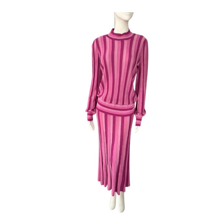 Mannequin wearing a pink striped outfit on a white background