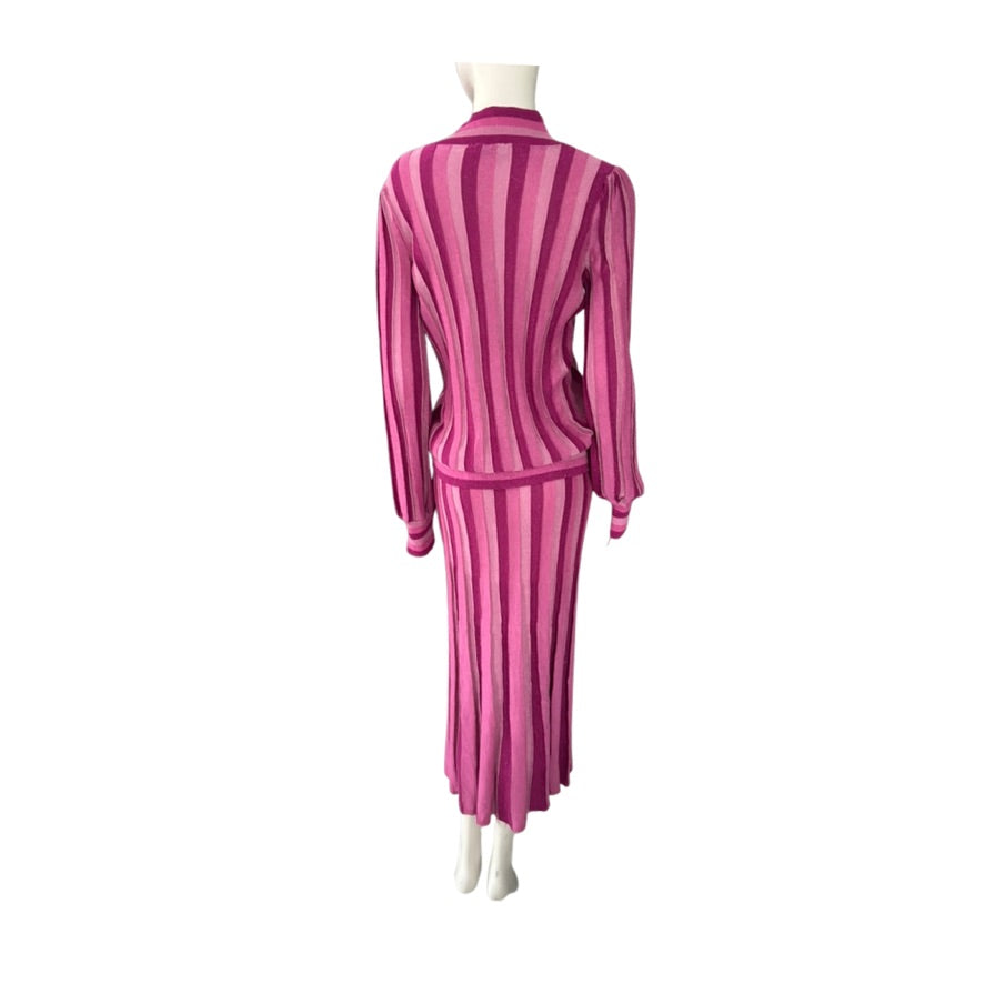 Mannequin wearing a pink and white striped outfit on a white background