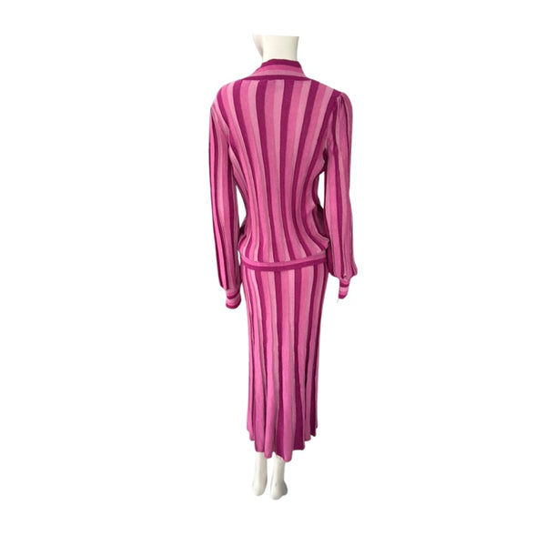 Mannequin wearing a pink and white striped outfit on a white background