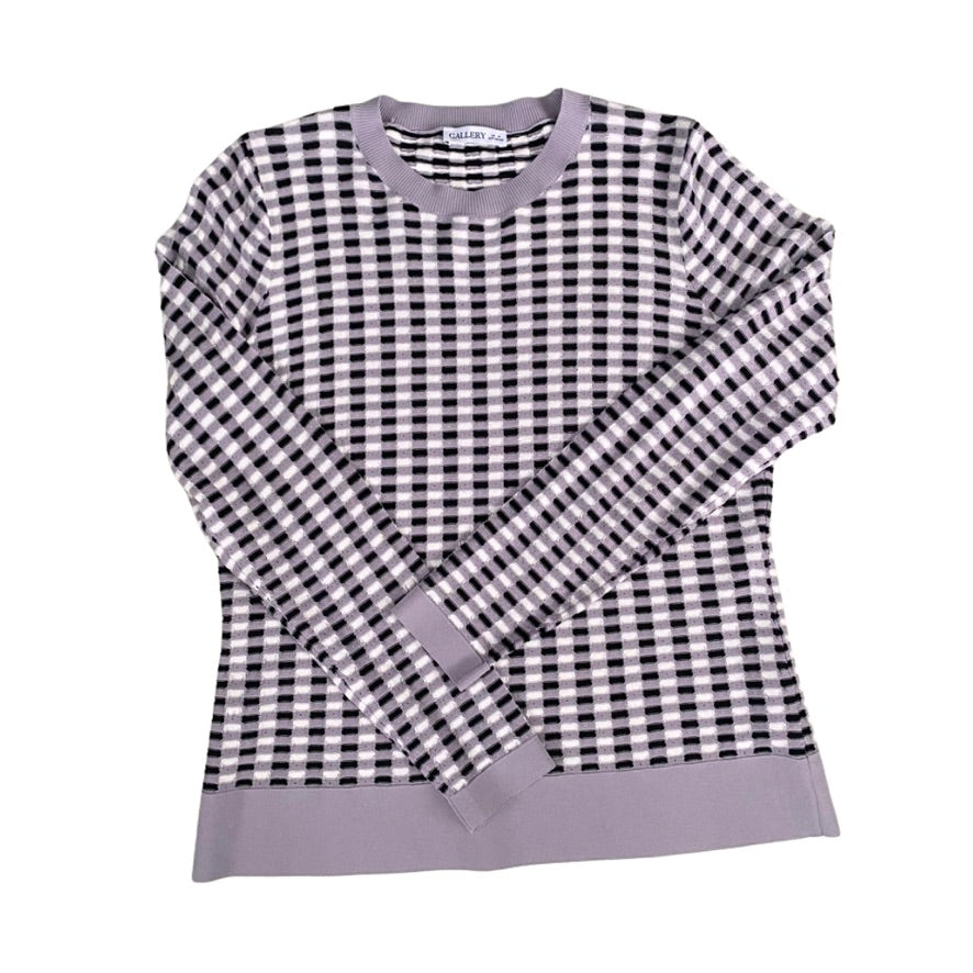 Black and white and lilac checkered sweater with purple trim on a white background