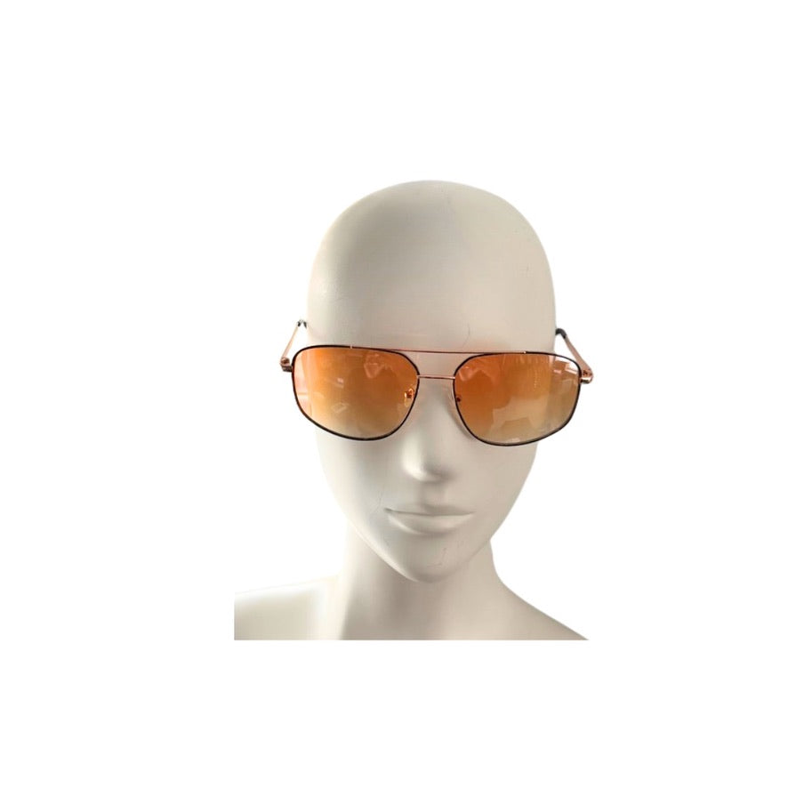 Sunglasses with orange lenses on a mannequin head against a white background