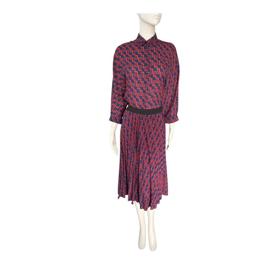 Mannequin wearing a red and blue patterned dress on a white background