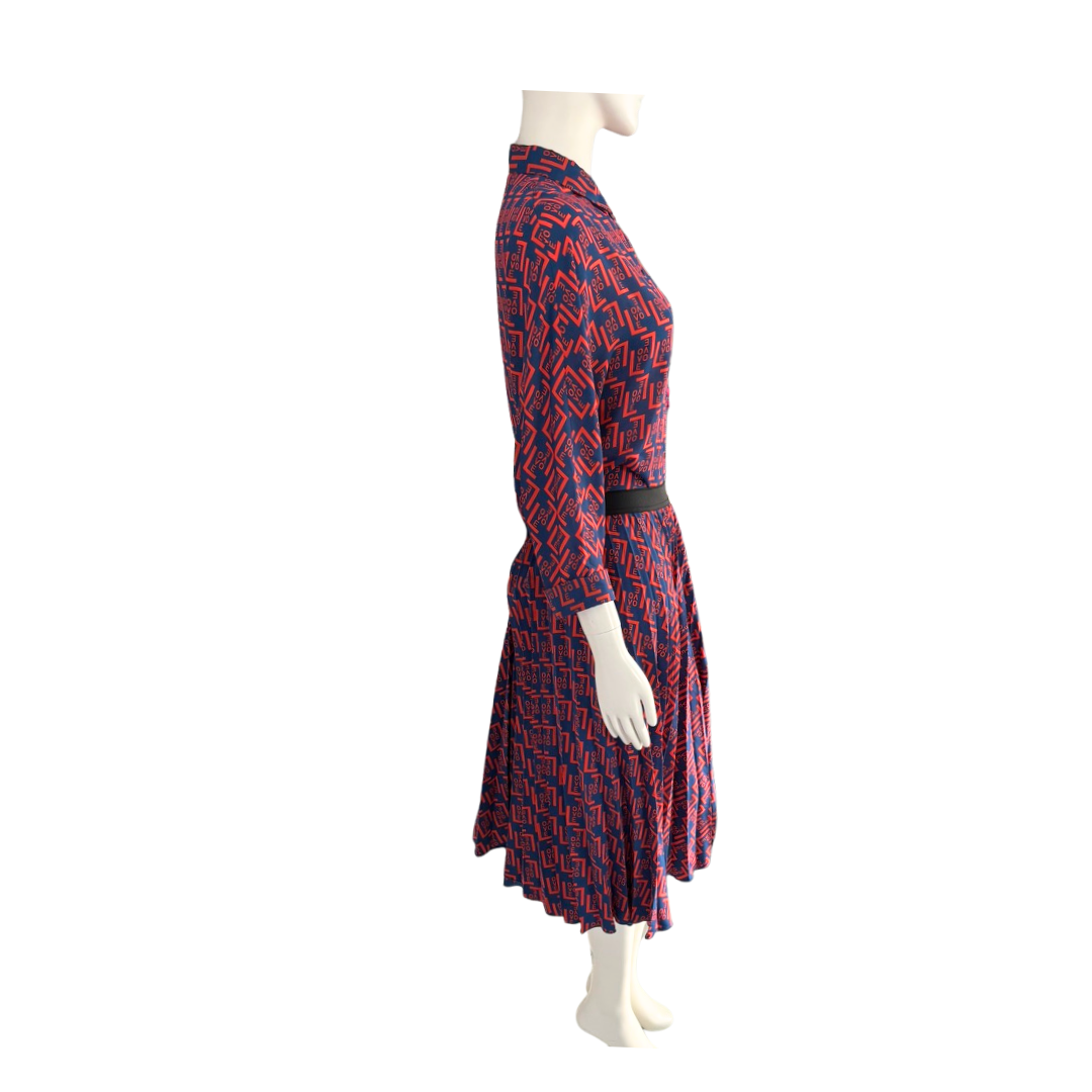 Mannequin wearing a red and blue patterned dress on a white background