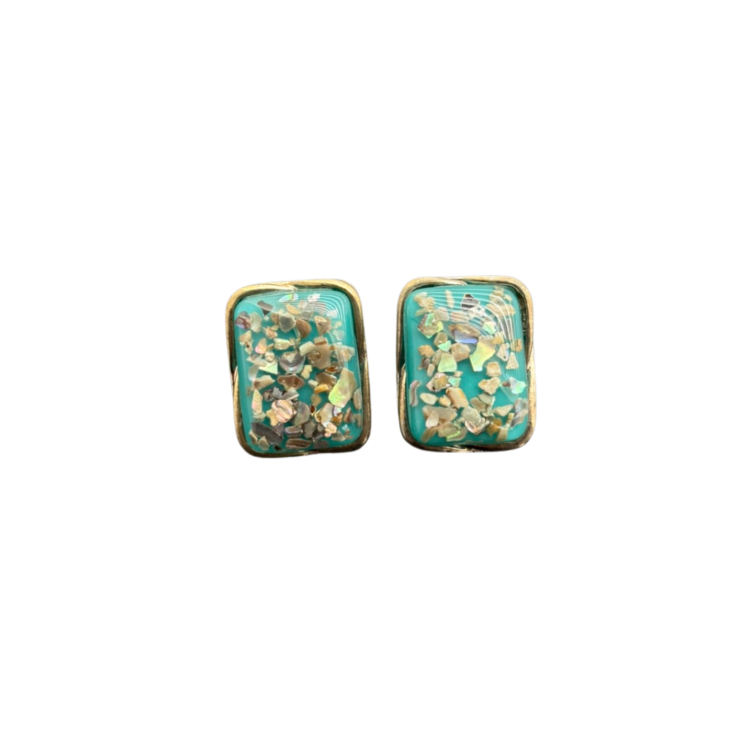 Pair of floral patterned earrings on a white background