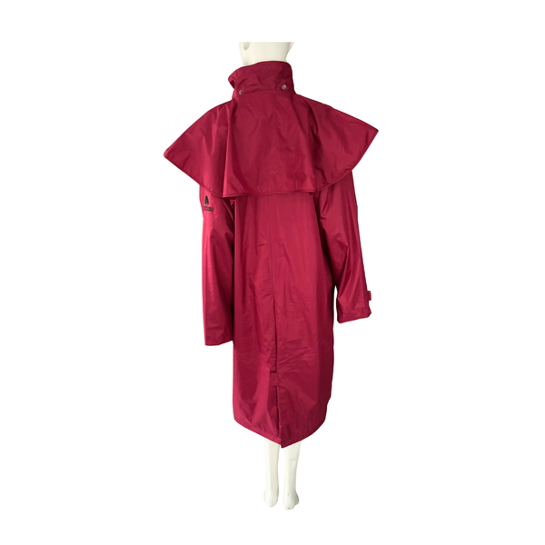 Red raincoat on a mannequin against a white background