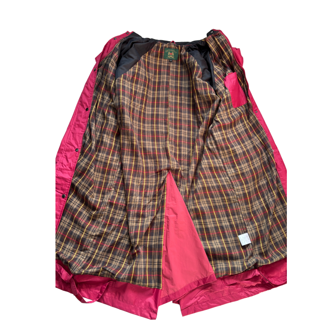 Plaid patterned garment with pink lining on a white background