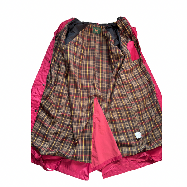 Plaid patterned garment with pink lining on a white background