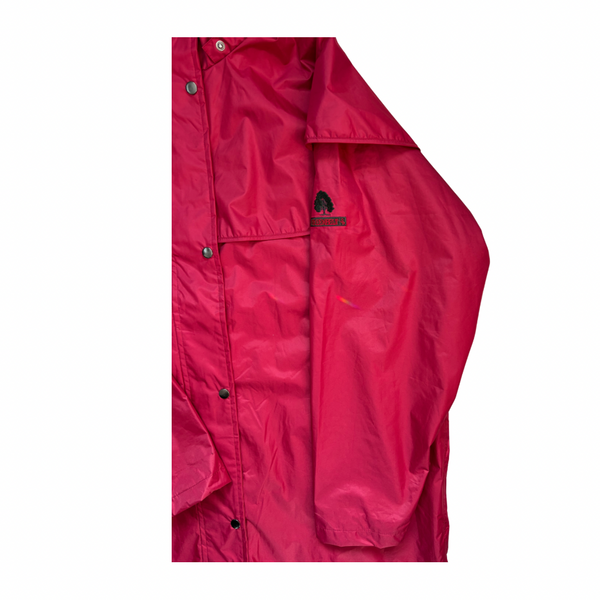 Close-up of a red jacket with a brand logo on a white background