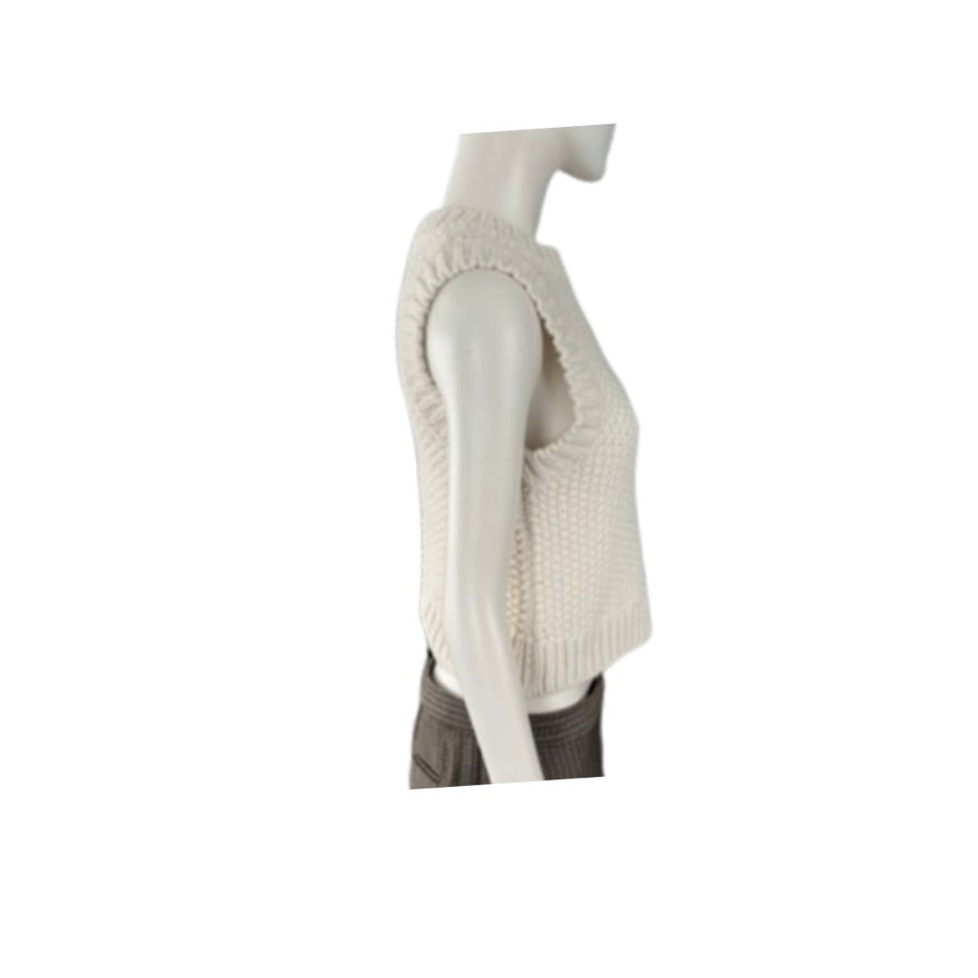 White knitted vest on a mannequin against a white background
