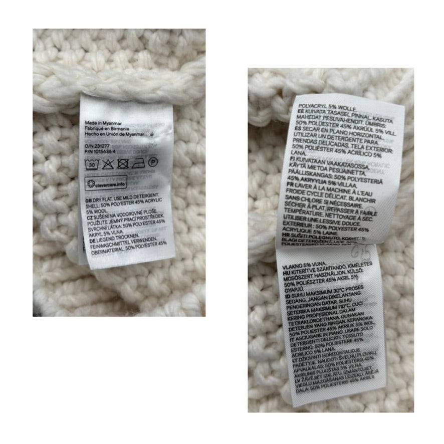 Close-up of fabric care labels on a textured white fabric background