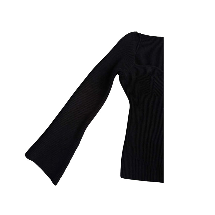 Black ribbed knit dress with wide sleeves on a white background