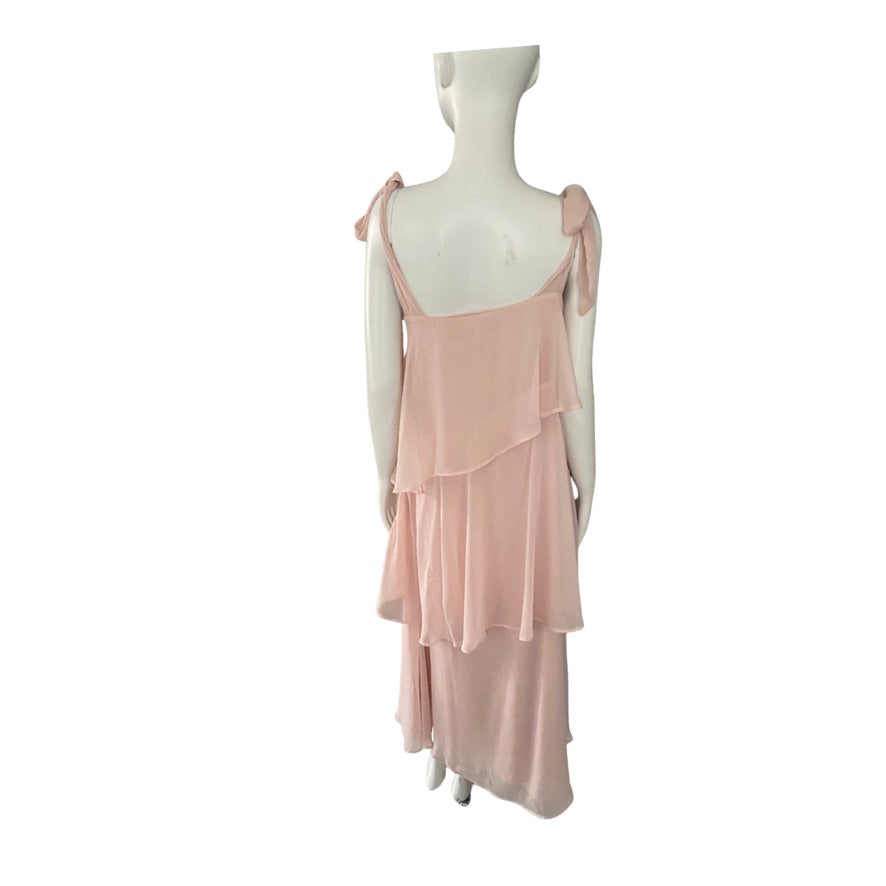 Mannequin wearing a light pink dress on a white background
