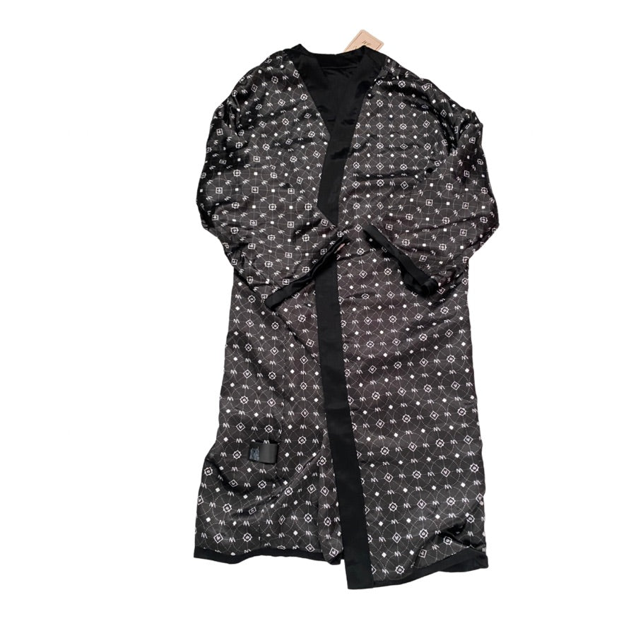 Black patterned robe on a white background
