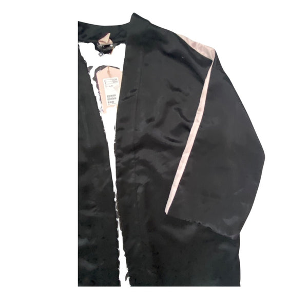 Black jacket with a visible brand label on a white background