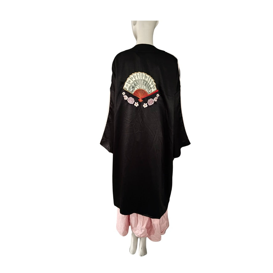 Black kimono-style garment with floral design on a mannequin against a white background