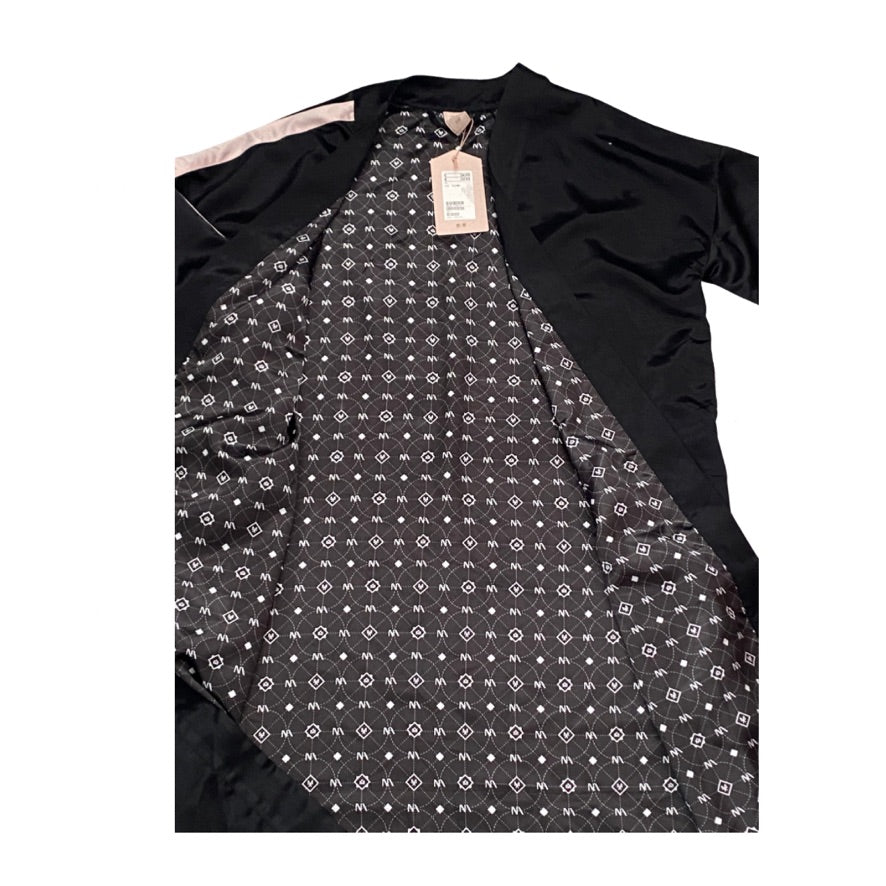 Black kimono with a patterned lining on a white background