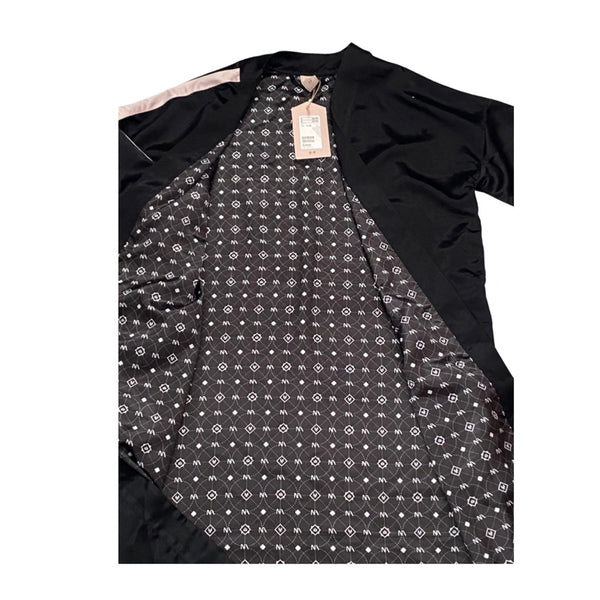 Black kimono with a patterned lining on a white background