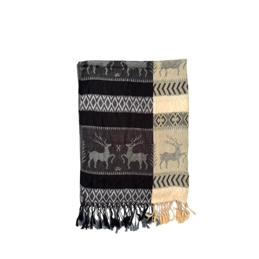 Patterned throw blanket with deer design on a white background